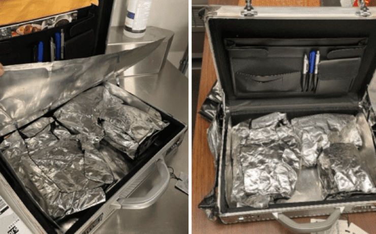 a suitcase with foil and a pen