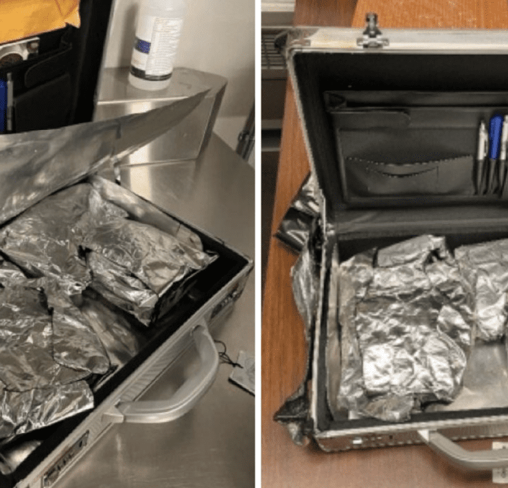 a suitcase with foil and a pen