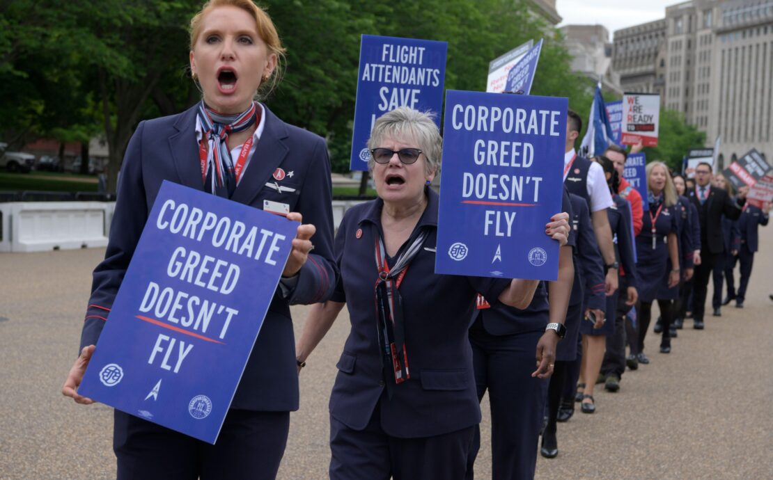 a group of people holding signs