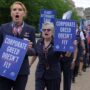 a group of people holding signs