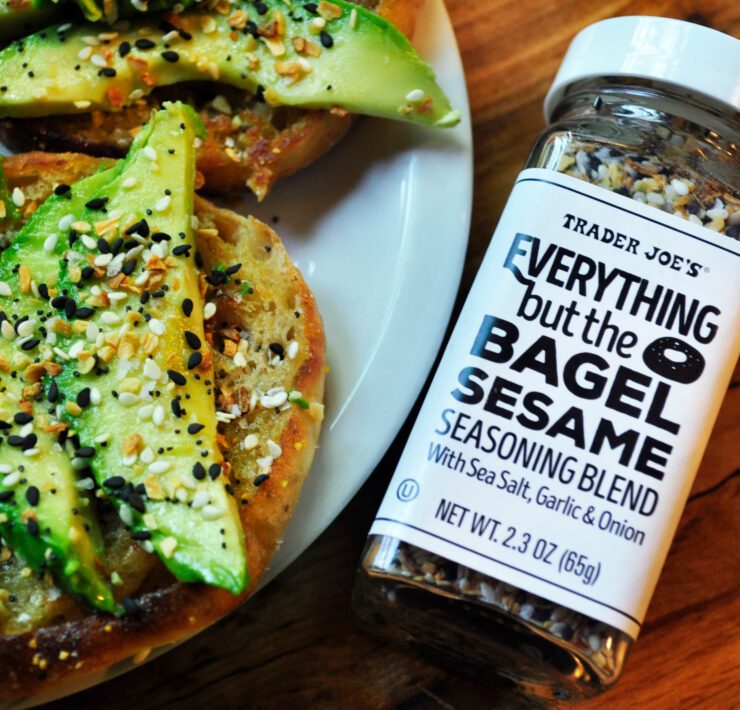 a plate of food next to a bottle of seasoning