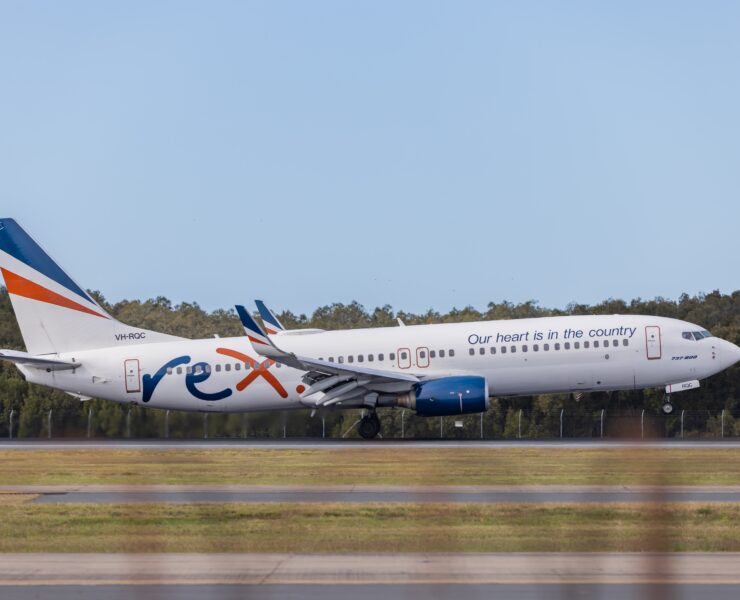 a white airplane on a runway