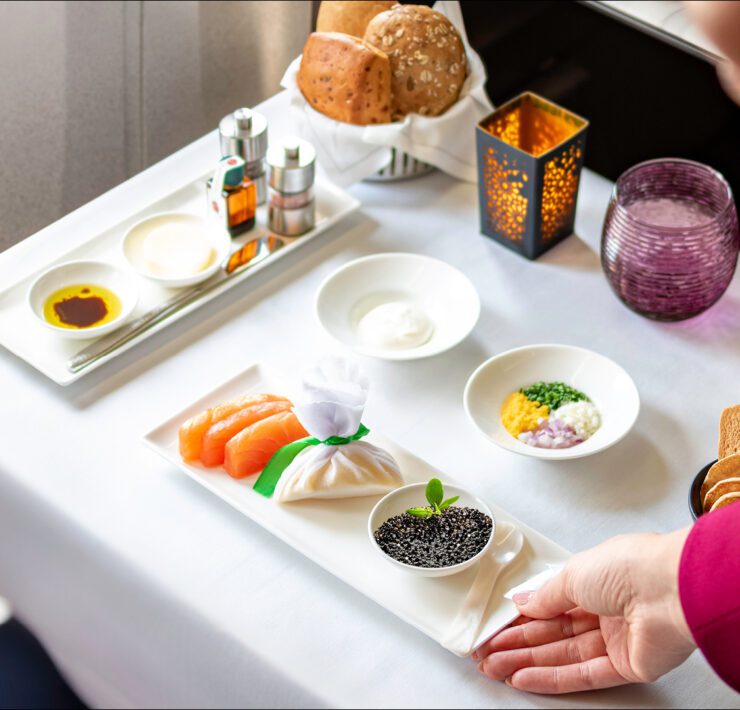 a person holding a plate of food