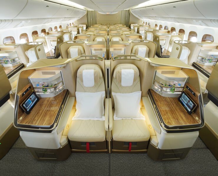 a room with rows of seats and a laptop on the side