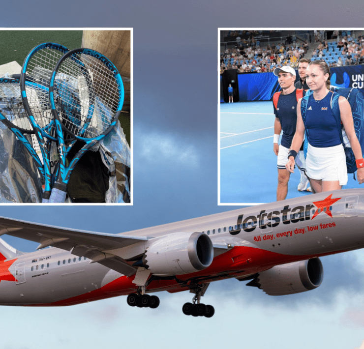 a plane with tennis rackets and people in the background
