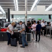 a group of people standing in a terminal