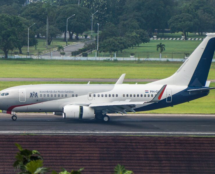 a white airplane on a runway