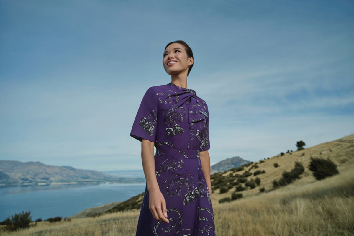 a woman in a purple dress