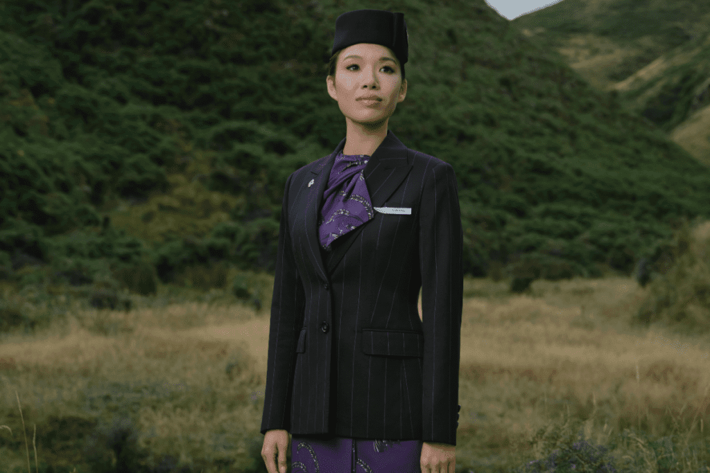 a woman in a suit and hat