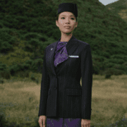 a woman in a suit and hat
