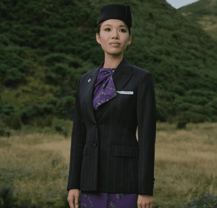 a woman in a suit and hat