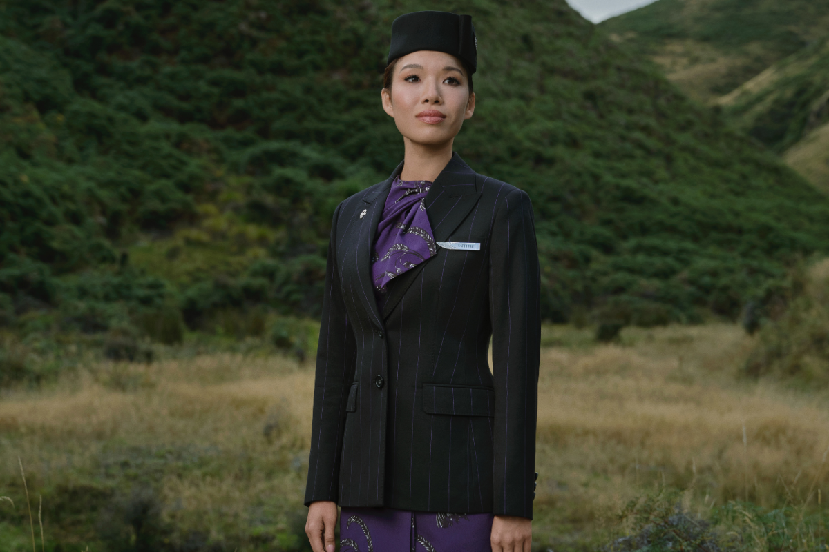 a woman in a suit and hat