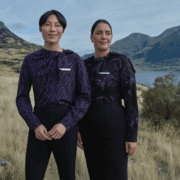 two people standing in a field
