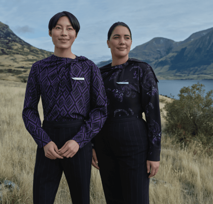 two people standing in a field