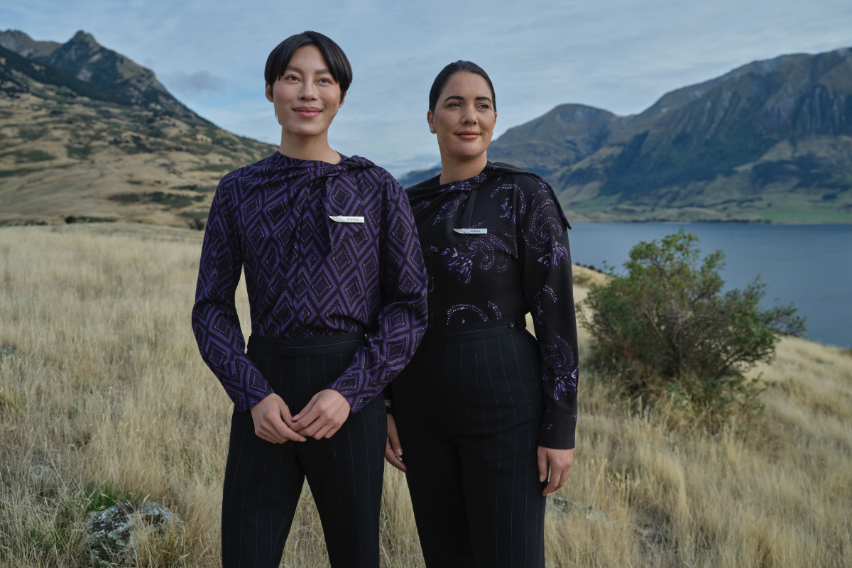 two people standing in a field