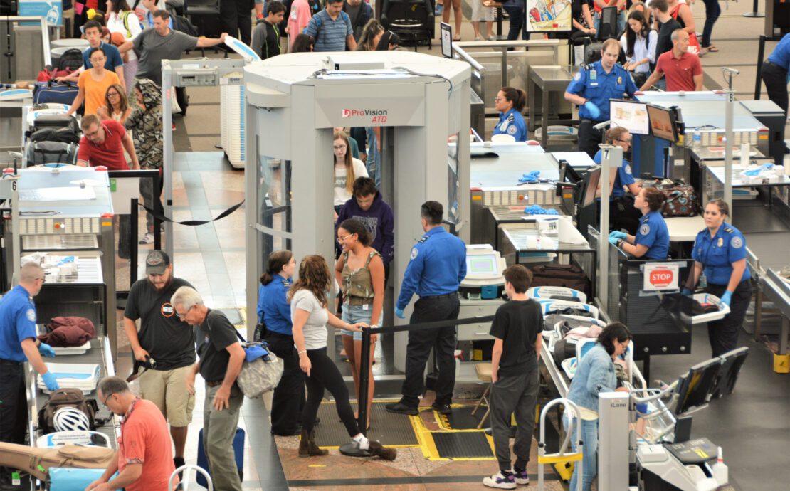 Passengers passing through a TSA checkpoint