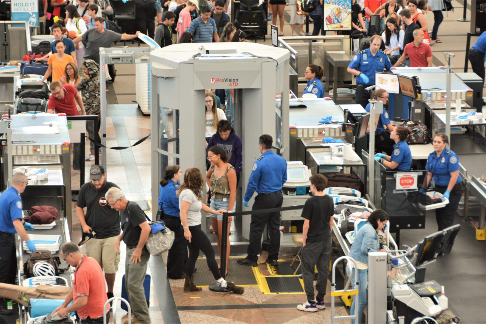 Passengers passing through a TSA checkpoint