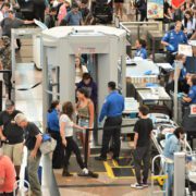 Passengers passing through a TSA checkpoint