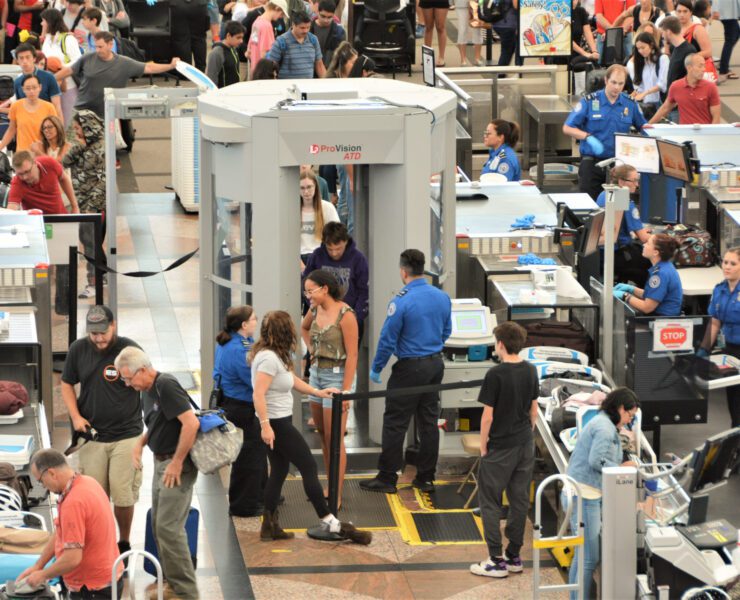 Passengers passing through a TSA checkpoint