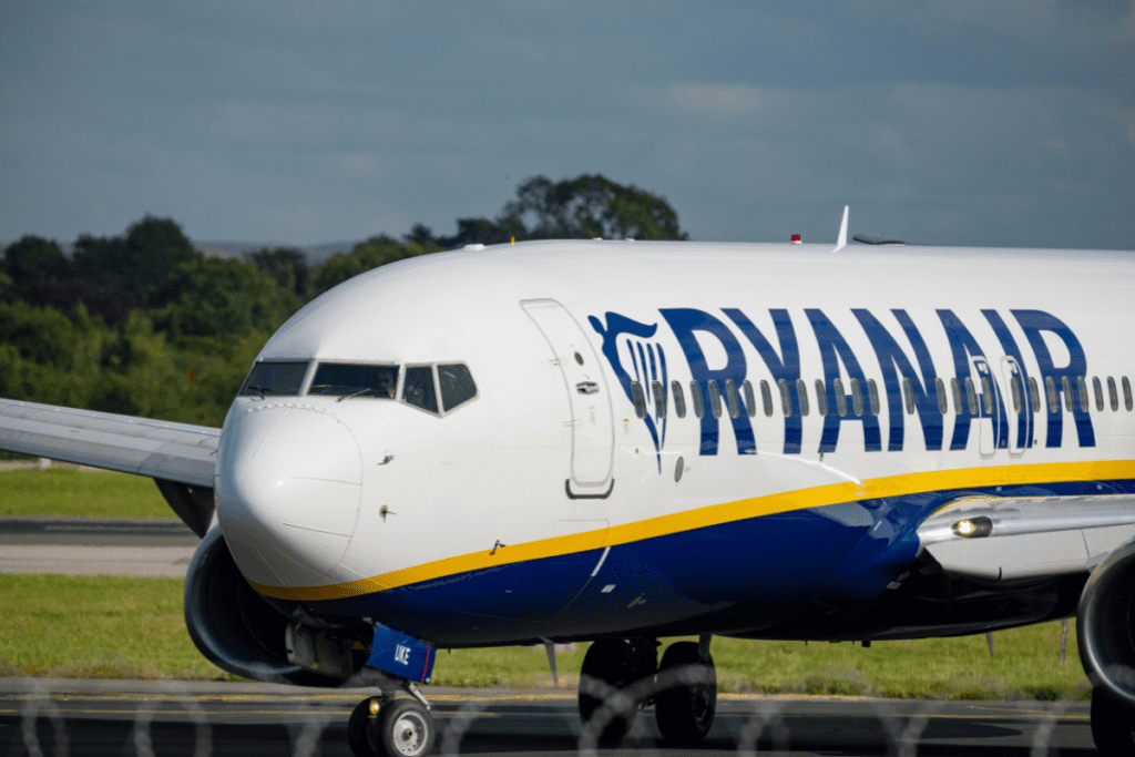 A Ryanair Boeing 737 behind a barbed wire fence