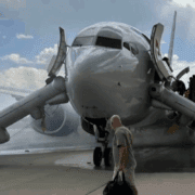 a man walking towards an airplane