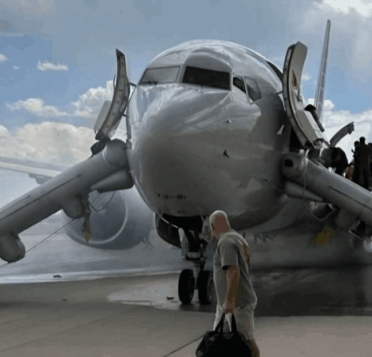 a man walking towards an airplane