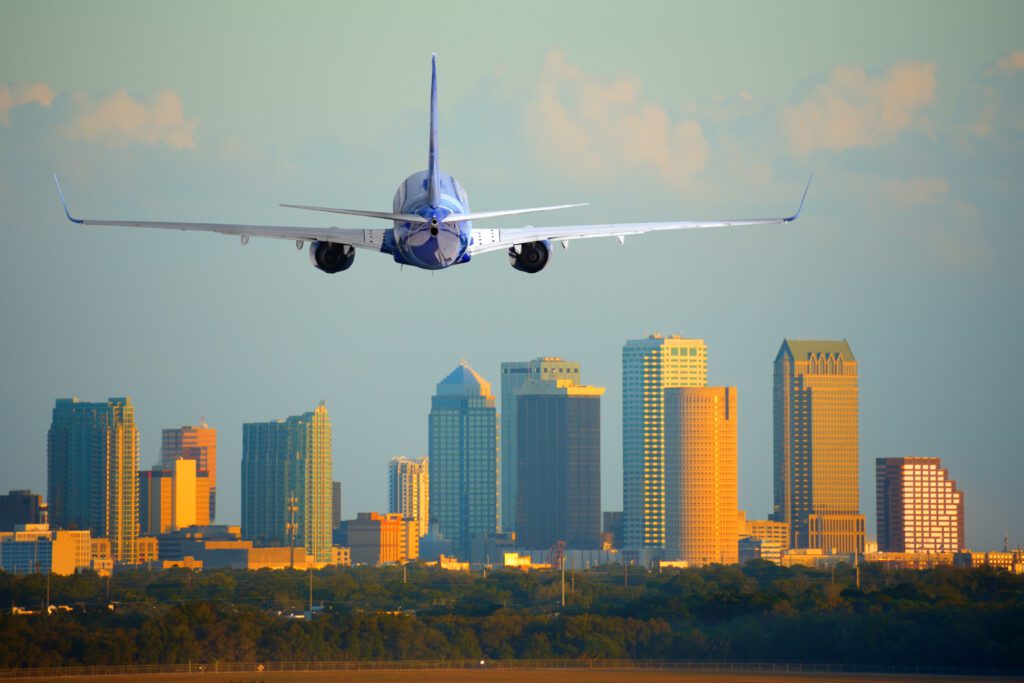 a plane flying over a city