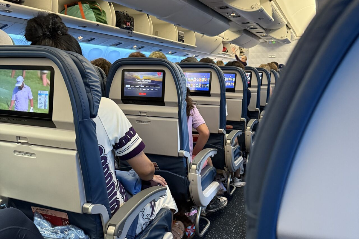 a group of people sitting in an airplane