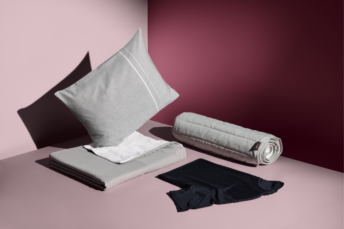 a pillow and a rolled up blanket