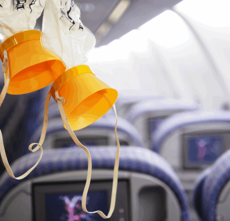 oxygen masks hanging from the ceiling of an airplane cabin
