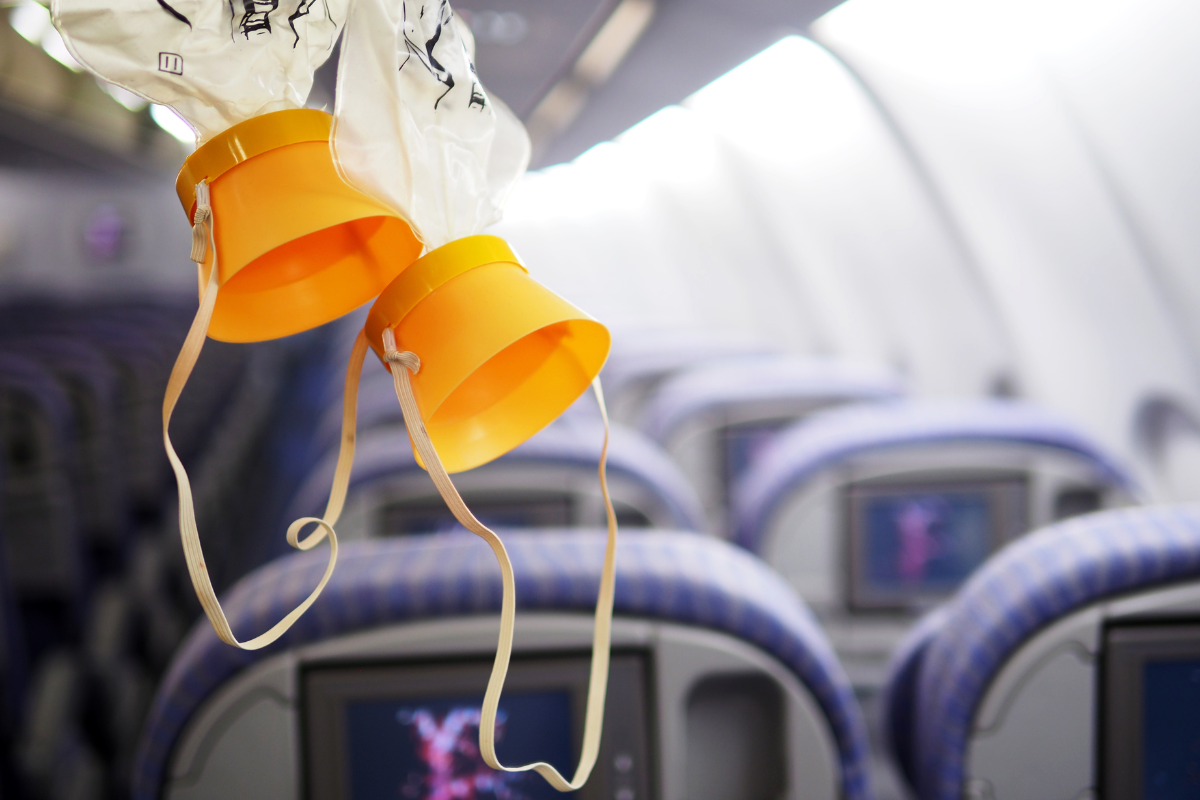 oxygen masks hanging from the ceiling of an airplane cabin