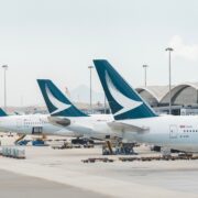 three cathay pacific aircraft parked at the gate at Hong Kong international airport