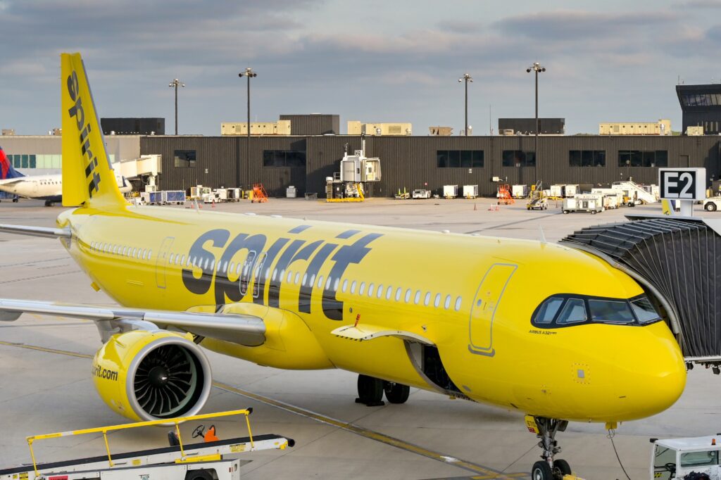 a spirit airlines aircraft parked at the gate