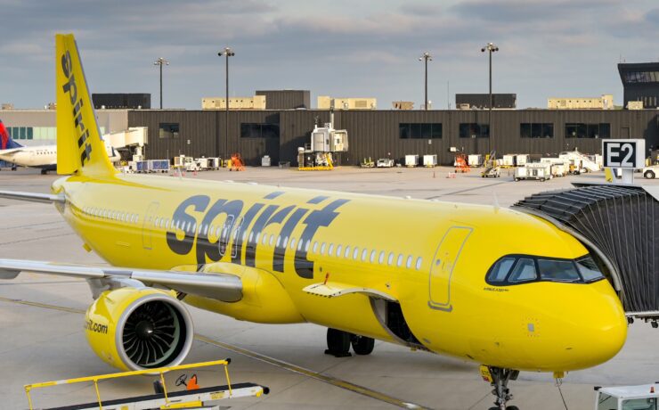 a spirit airlines aircraft parked at the gate