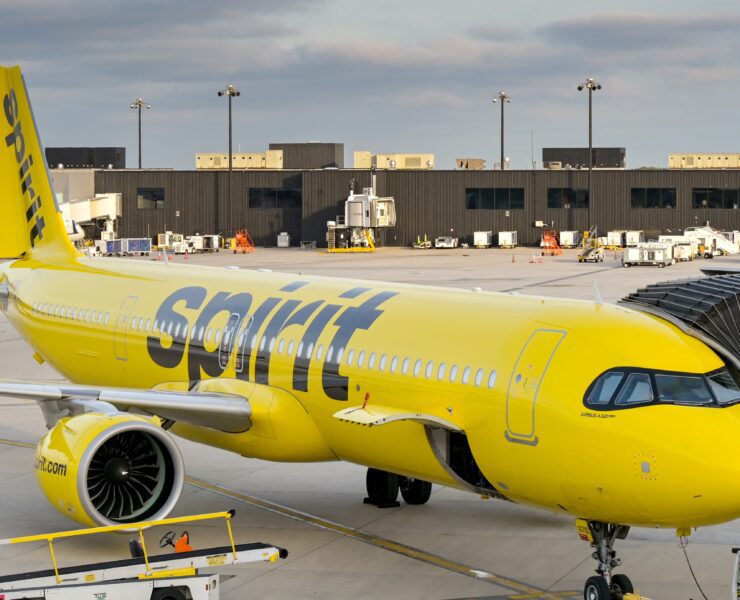 a spirit airlines aircraft parked at the gate