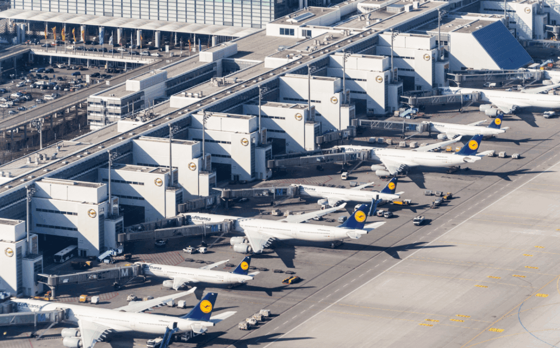 an aerial view of airplanes parked at an airport