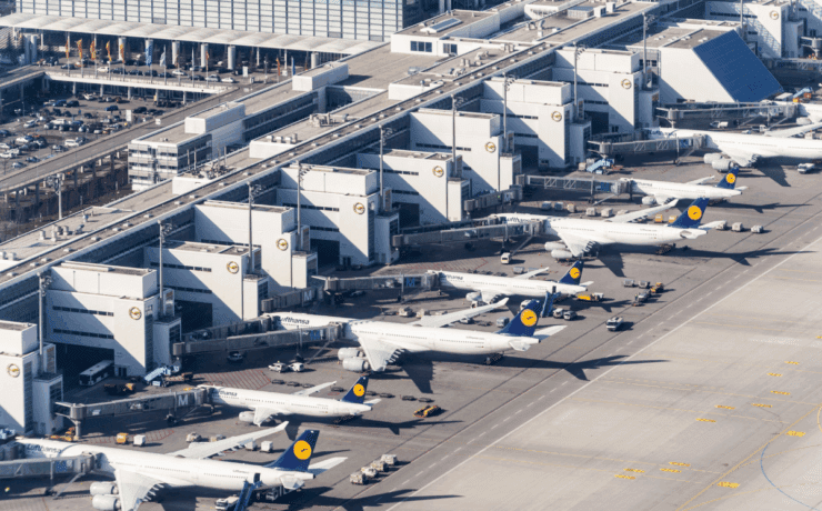 an aerial view of airplanes parked at an airport
