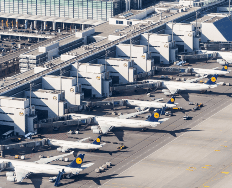 an aerial view of airplanes parked at an airport