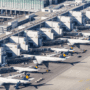 an aerial view of airplanes parked at an airport