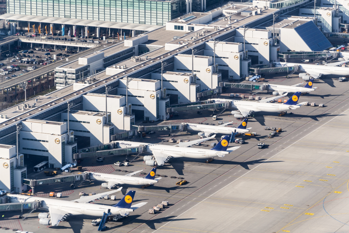 an aerial view of airplanes parked at an airport