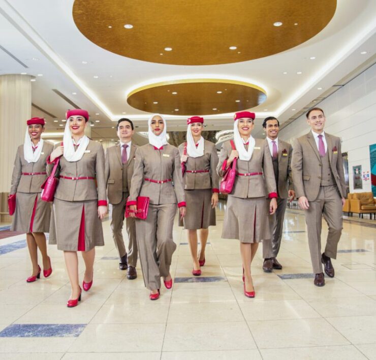 a group of people in suits walking in a room