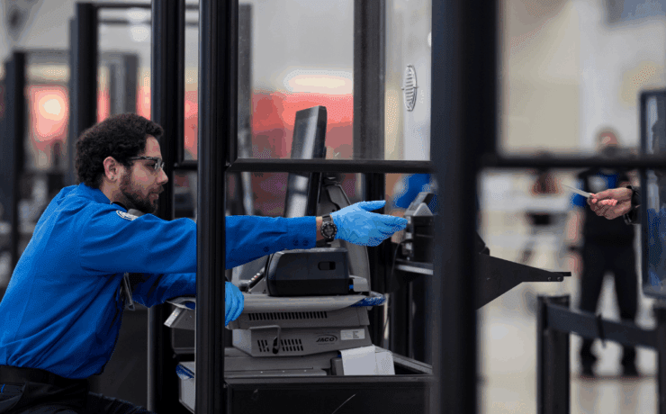 tsa agent behind a screen
