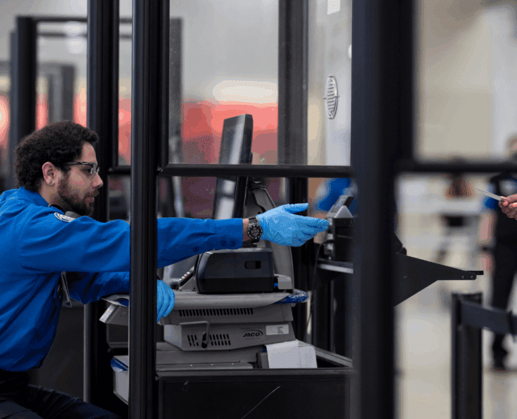 tsa agent behind a screen