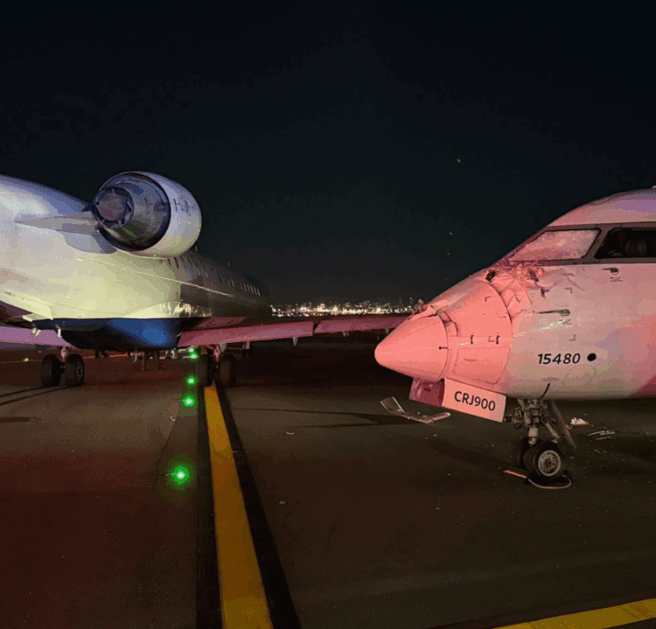 two delta air line regional jets collide on runway showing damage to cockpit of one plane