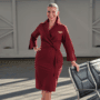 a delta air lines flight attendant wears a new version of the carrier's iconic wrap dress