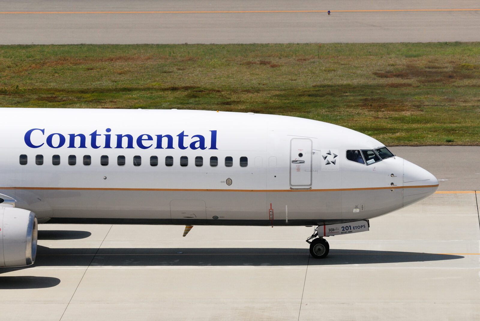 a white airplane on a runway
