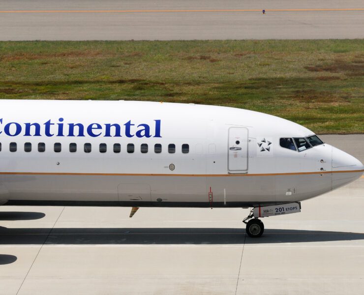 a white airplane on a runway