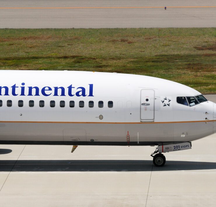 a white airplane on a runway