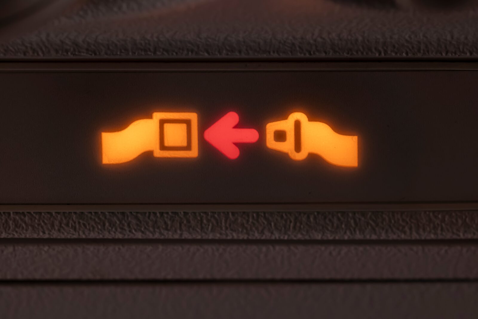 a close up of a seat belt sign