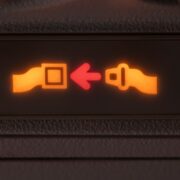 a close up of a seat belt sign